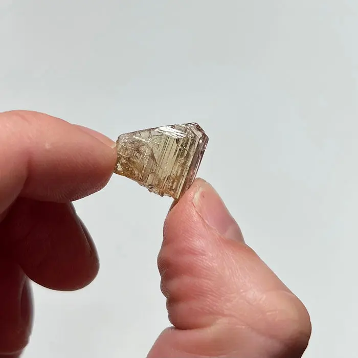12.61ct Yellowish Peach Natural Tanzanite Crystal 12.61ct Yellowish Peach Natural Tanzanite Crystal. Natural tanzanite crystal from Merelani Hills, Tanzania, photo 2 of 4